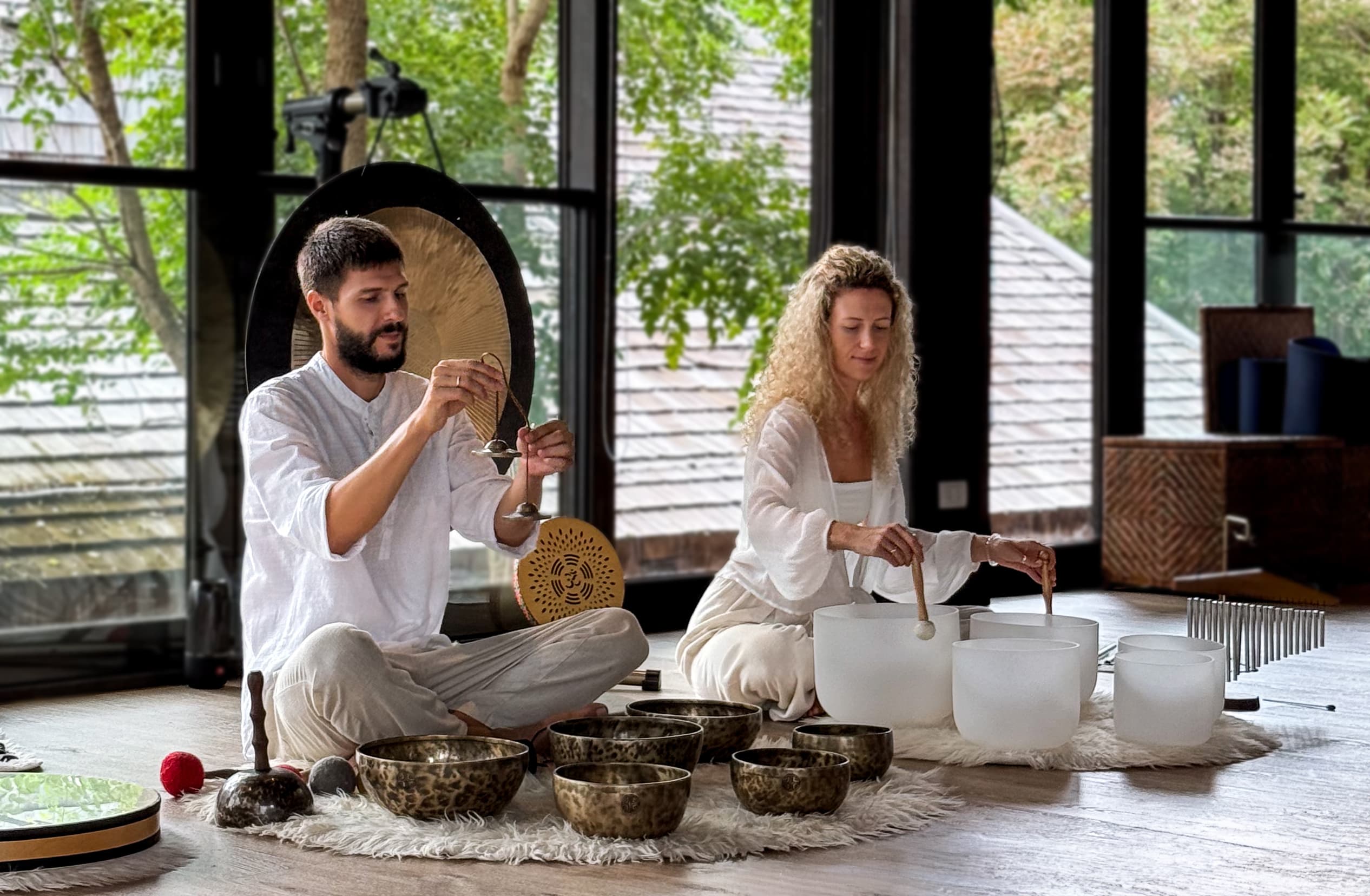 Sontera gift voucher set beside crystal bowls and gongs in a softly lit studio.