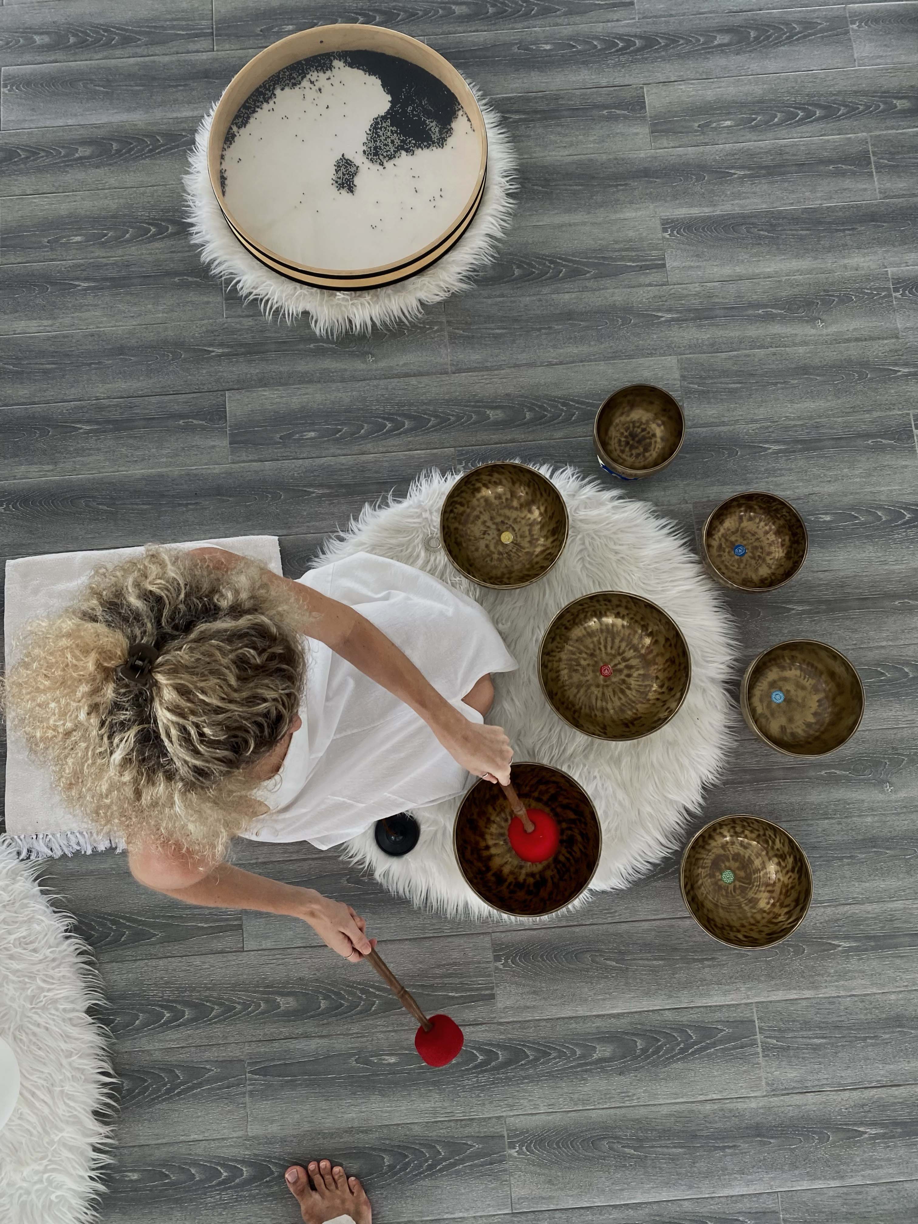 Sound healing bowls prepared for a sound and vibration session with Tibetan bowls and gongs